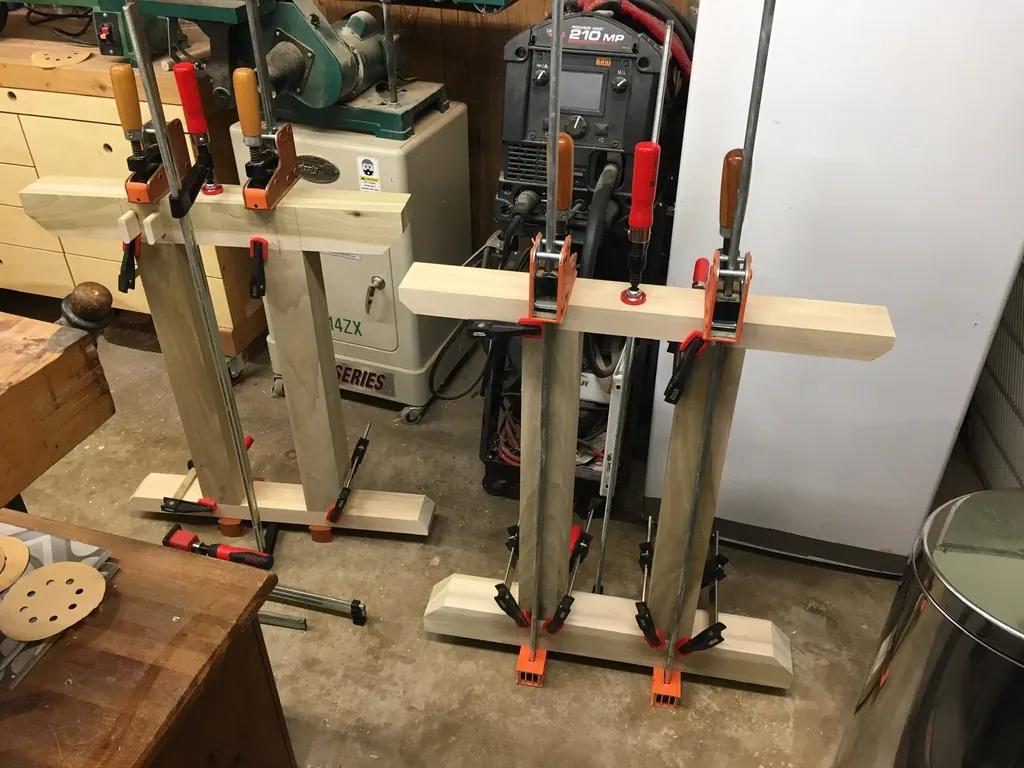 A glue-up clamped on the bench in the Tinkery workshop